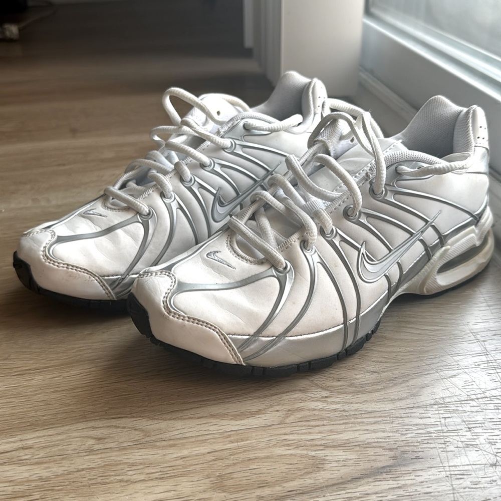 Woman’s NikeAir Max Sneaker Size 6. White leather with Metallic Silver Overlay.